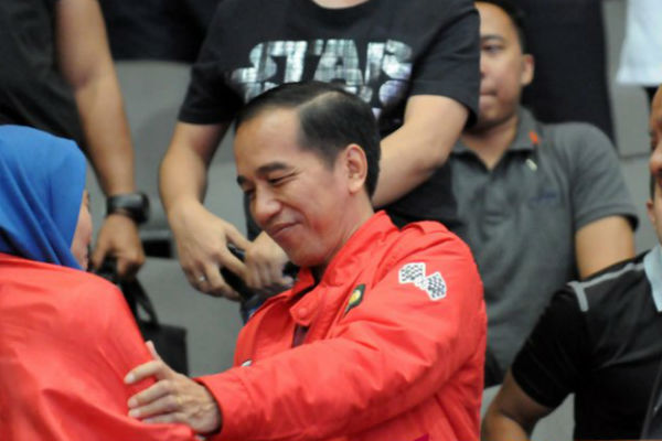 Ini Dia, Jaket Motor Merah yang Dipakai Jokowi saat Nonton Asian Games