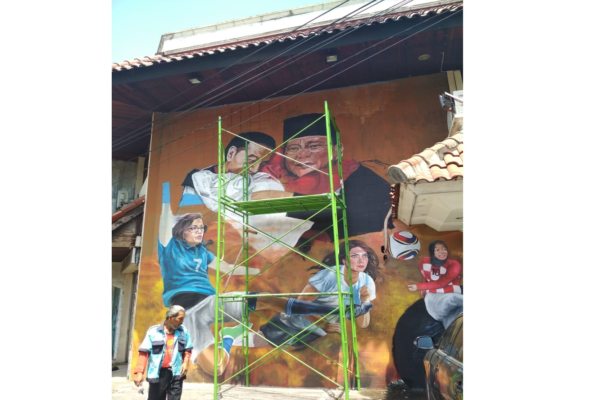 Di Solo, Pelukan Jokowi-Prabowo Diabadikan dalam Mural