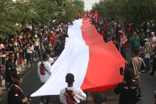 Berdoa untuk Pelantikan Jokowi-Ma'ruf, Warga Jogja Gelar Parade Merah Putih